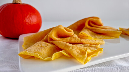Close-up of crepes with decorative pumpkin