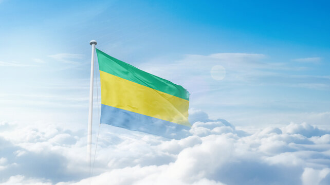 Gabon national flag waving in the sky. Gabon national flag for independence day.