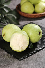 Fresh Guava Fruit with Cream Flesh on Slate Board - Tropical Healthy Eating