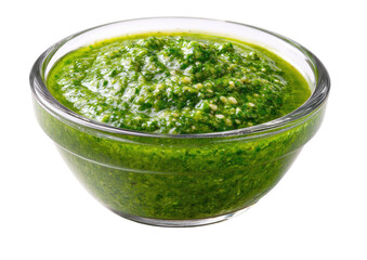 Vibrant green pesto sauce in a glass bowl