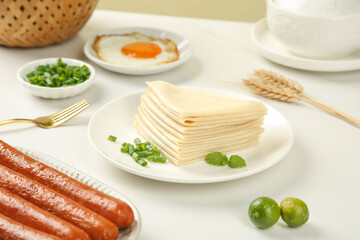 Handmade Spring Flavored Crepes with Sausages and Fried Egg Breakfast Spread