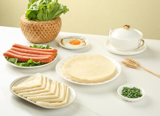 Traditional breakfast table with handmade pancakes, cheese, sausages and fresh ingredients