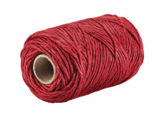 Red thread wound around a cardboard tube