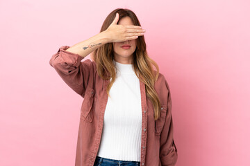 Caucasian woman isolated on pink background covering eyes by hands. Do not want to see something