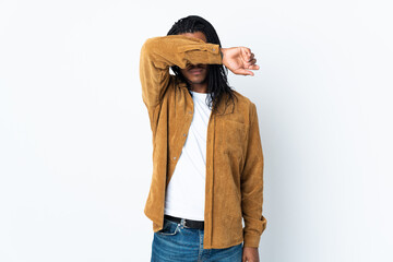 Delivery African American man with braids isolated on white background covering eyes by hands