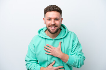 Fototapeta premium Young caucasian man isolated on white background smiling a lot