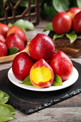 Fresh Red Nectarines with Yellow Flesh on Rustic Wooden Table - Healthy Summer Stone Fruit