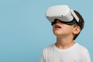 Boy wearing VR headset looking up with wonder. Clean blue background and copy space on the left perfect for technology advertising
