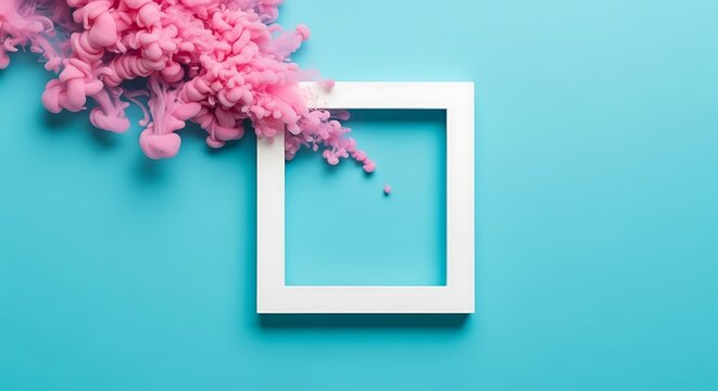 Pink ink cloud exploding from a white picture frame on blue background