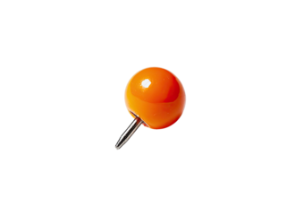 Orange pushpin, shiny head, metal point, dark background