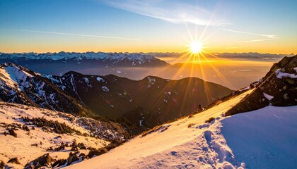 Golden Sunrise Over Snow Covered Mountain Range With Distant Cityscape And Clear Sky