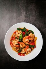 Stir fried spicy shrimp in a white plate