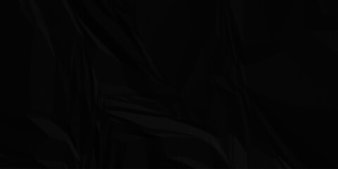 Black crumpled paper creased grunge texture. Paper wrinkled surface glued paper poster background.