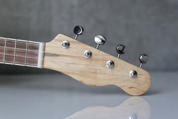 Musical instrument - Closeup front view Headstock ukulele acoustic guitar