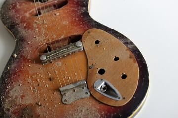 Musical instrument - Top view closeup fragment old, dirty, broken guitar