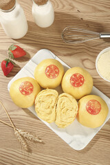 Handmade Chinese Steamed Pumpkin Buns with Blessing Stamps Traditional Asian Food on Wooden Background