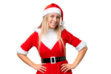 Young blonde woman with christmas hat over isolated chroma key background posing with arms at hip and smiling