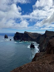 Rocky Island Peaks Above Blue Sea
