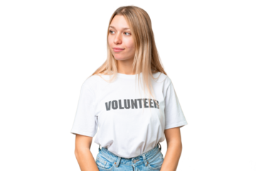 Young volunteer woman over isolated chroma key background looking to the side