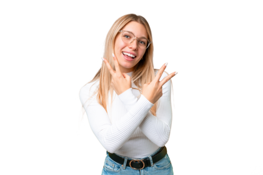 Young pretty blonde woman over isolated chroma key background smiling and showing victory sign