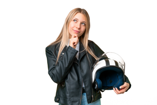 Young pretty blonde woman with a motorcycle helmet over isolated chroma key background and looking up