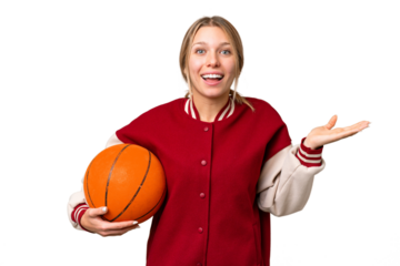 Young hispanic woman playing basketball over isolated white background with shocked facial expression