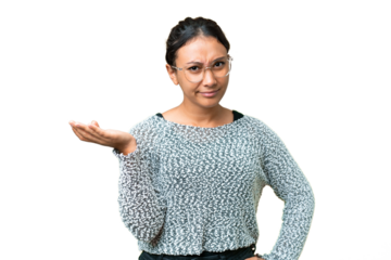 Young Uruguayan woman over isolated chroma key background having doubts