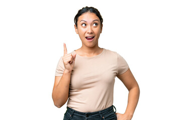 Young Uruguayan woman over isolated chroma key background intending to realizes the solution while...