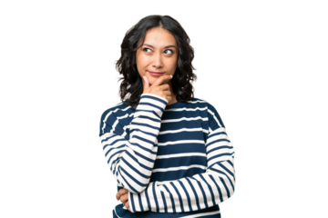 Young Argentinian woman over isolated background having doubts and with confuse face expression