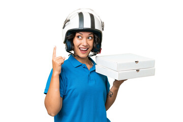 Pizza delivery Argentinian woman with work uniform picking up pizza boxes over isolated background intending to realizes the solution while lifting a finger up
