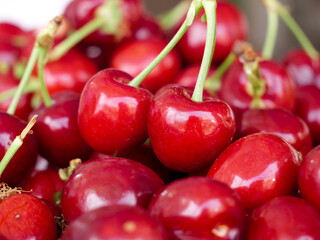 Fresh Red Cherries with Green Stems - Healthy Summer Fruit Background