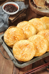 Golden Puff Pastry Rolls with Sauce on Rustic Wooden Tray - Fresh Baked Goods