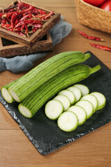Fresh Silk Melon Slices with Dried Chili Peppers - Traditional Chinese Vegetables from Shouguang Shandong