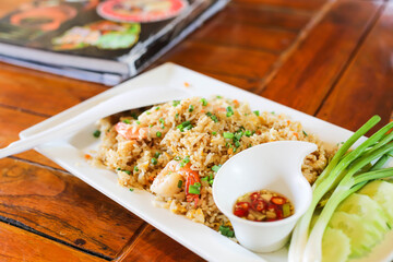 fried rice with shrimps and crab on white plate