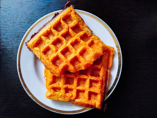 Delicious waffles stacked on a plate for breakfast