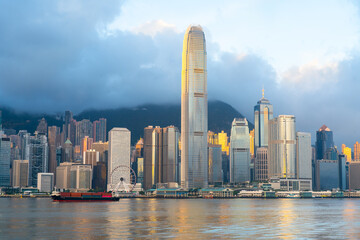 Fototapeta premium Hong Kong cityscape skyline at sunrise sky across Victoria harbor. One of the most tourist attaction in Hong Kong Island, China.