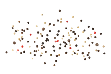 Dried mixed pepper flying isolated on white background. Aromatic spicy ingredient for cuisine.