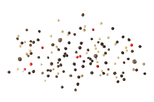 Dried mixed pepper flying isolated on white background. Aromatic spicy ingredient for cuisine.