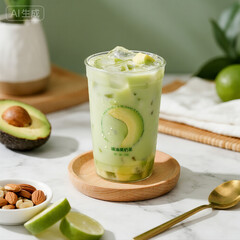 Iced Avocado Lime Smoothie with Fresh Ingredients on Marble Table