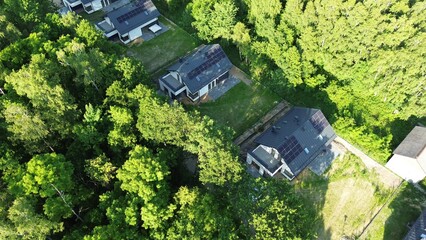 New homes with solar panels and backyards © AlexGo