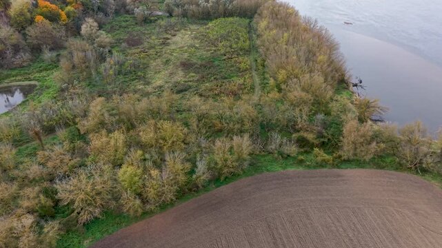 Aerial Vistula River farm land north Poland 2. Forests with rural farm agriculture farm landscape. Historic and economic basis of eastern Europe. Autumn fall colors. Rich agricultural heritage.