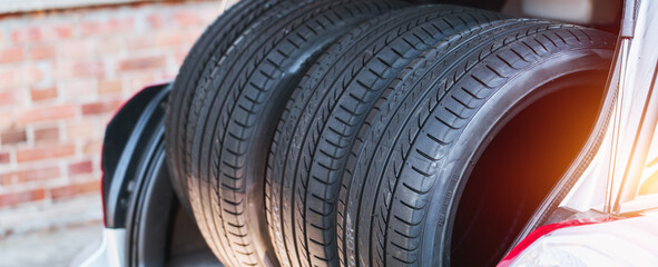Performance tires neatly arranged in open trunk