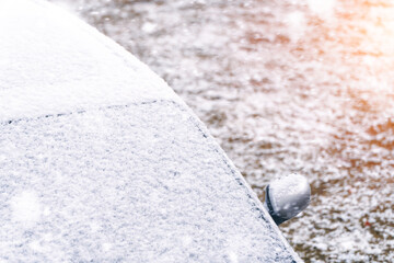 Snow and ice covering windshield on frosty day
