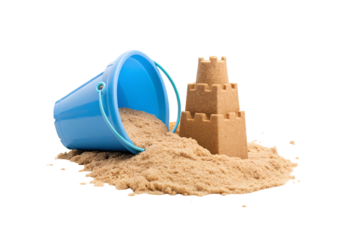 Blue beach bucket tipped over with sand spilling out and small sandcastle beside it, isolated on a transparent background