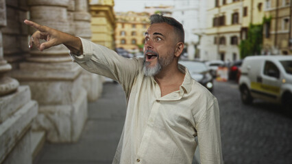 Fototapeta premium Man points finger at a passing car on a narrow city street, open linen shirt visible; surprise discovery curiosity.