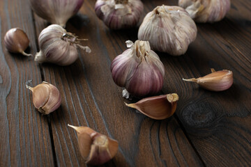Fresh Garlic Bulbs and Cloves on Rustic Wooden Surface for Culinary Delight
