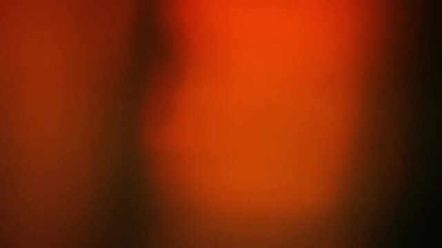 Dynamic Light Leak Transition Overlay: Rapid Cinematic Flares and Vertical Red/Orange Streaks