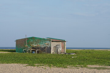 Prefabricated portable toilet block, readymade toilet, located on a beach.
