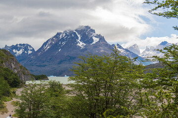 Obraz premium View of the mountain landscape in the national park Torres del Paine, Patagonia, Chile, South America. The lake Grey with iceberg and the horns in the background.