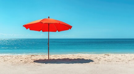 Bright red beach umbrella on sandy shore